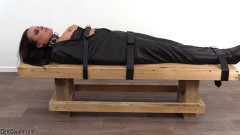 Lori strapped in a body bag